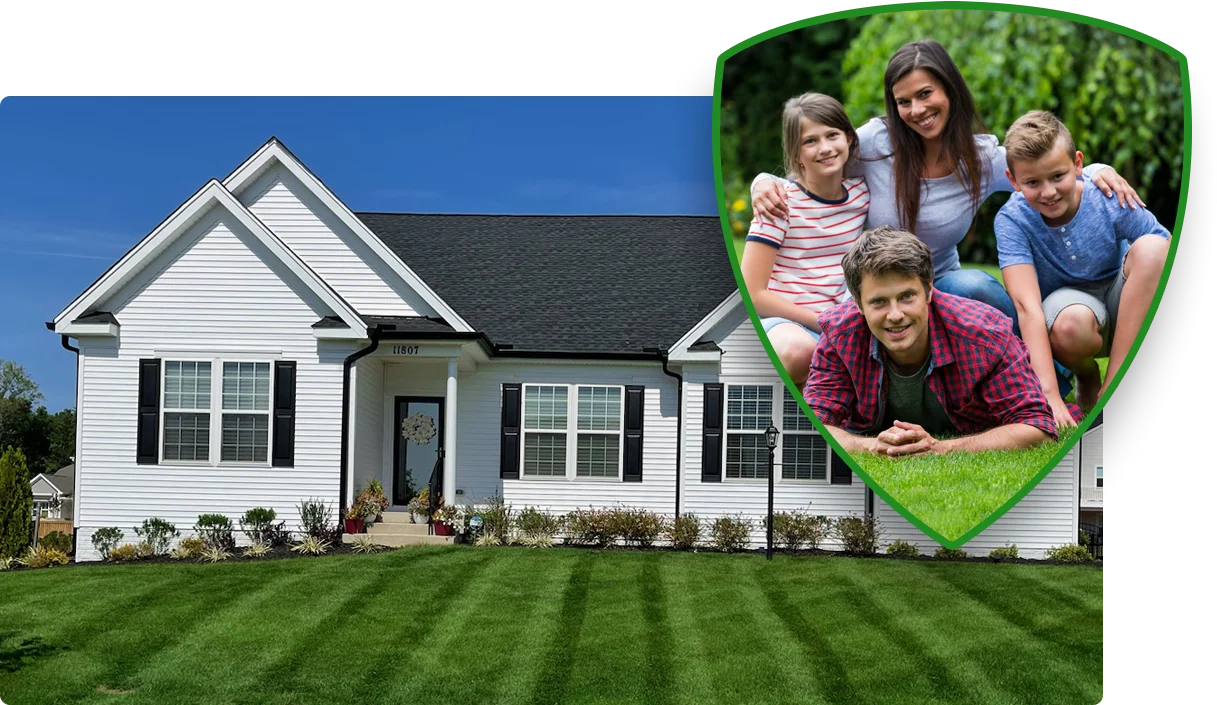 family laying on green grass