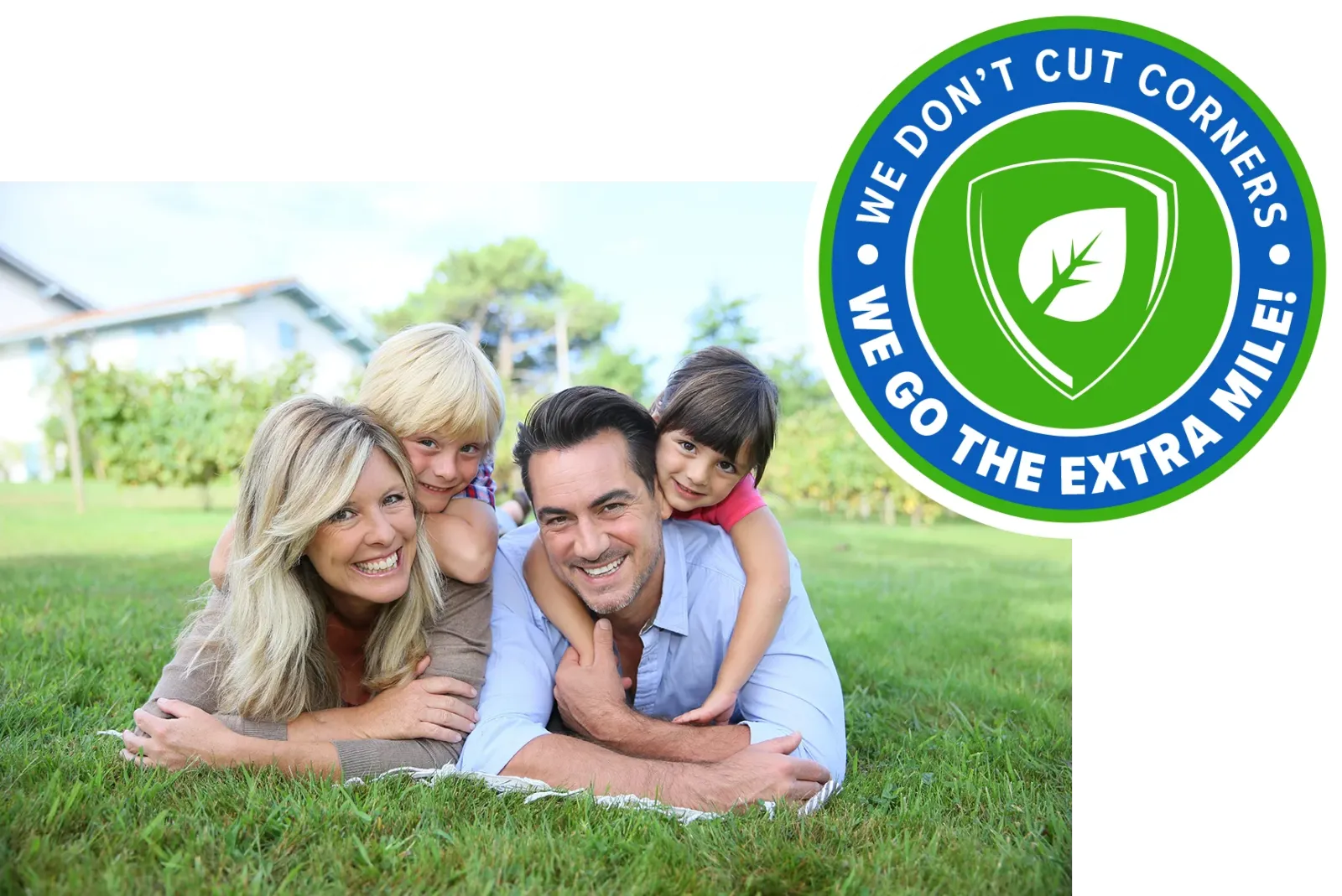 family laying on grass