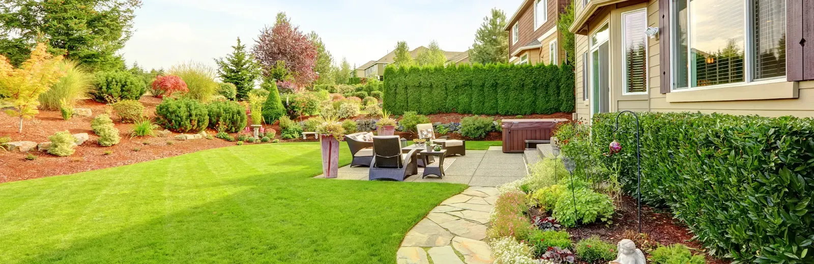 house with nicely landscaped back yard